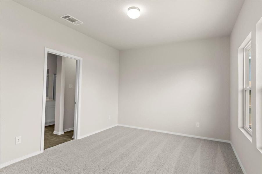 Carpeted empty room with baseboards