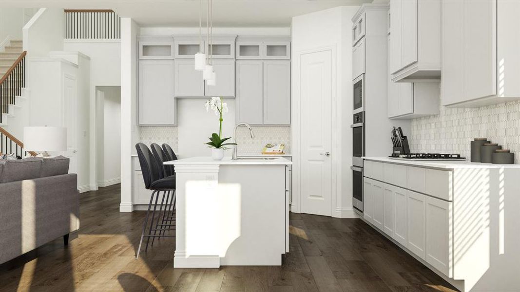 Kitchen featuring white cabinetry, a kitchen breakfast bar, an island with sink, pendant lighting, and dark hardwood / wood-style flooring