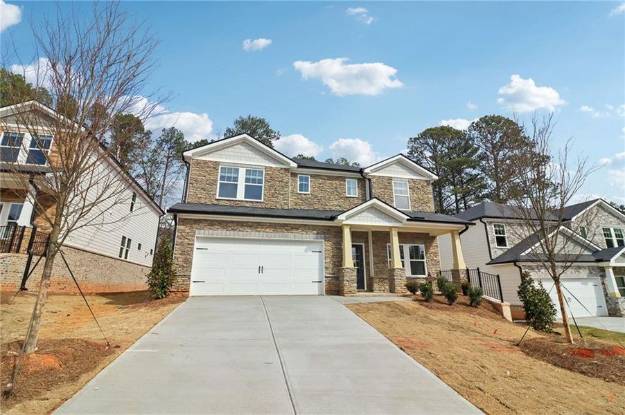 Front exterior of a new home in Harmony Manor, Fairburn, GA, highlighting curb appeal (Image 29).