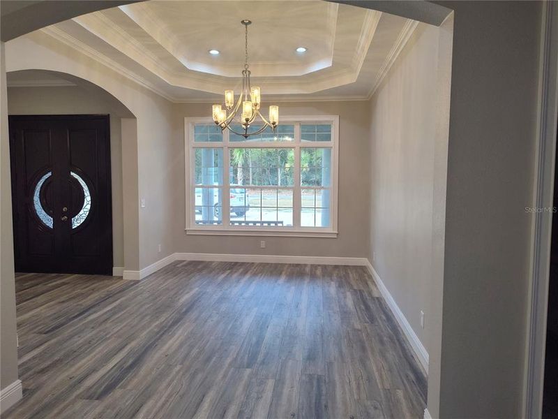 Formal dining rooom with chandelier