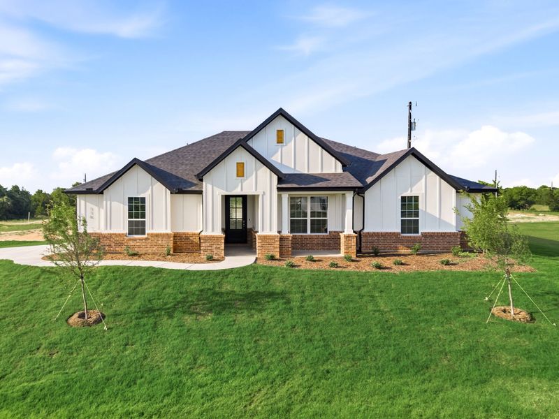 Front exterior of a new home in Saddleback Estates, Boyd, TX, highlighting curb appeal (Image 25).