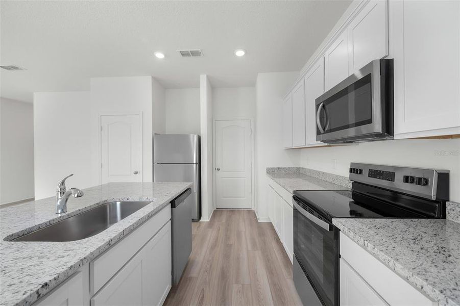 Furnished interior view inside a new home in Peach Crossings, Winter Haven (Image 7).