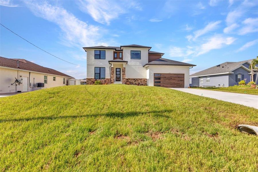 Front exterior of a new home in , Port Charlotte, FL, highlighting curb appeal (Image 28).