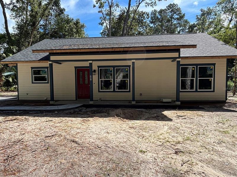 Front exterior of a new home in , Micanopy, FL, highlighting curb appeal (Image 2).