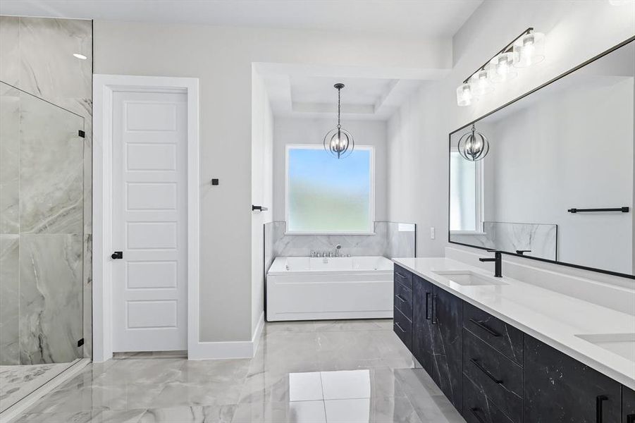 Bathroom with a bath, double vanity, a marble finish shower, and light marble finish floors Bathroom with a bath, double vanity, a marble finish shower, and light marble finish floors
