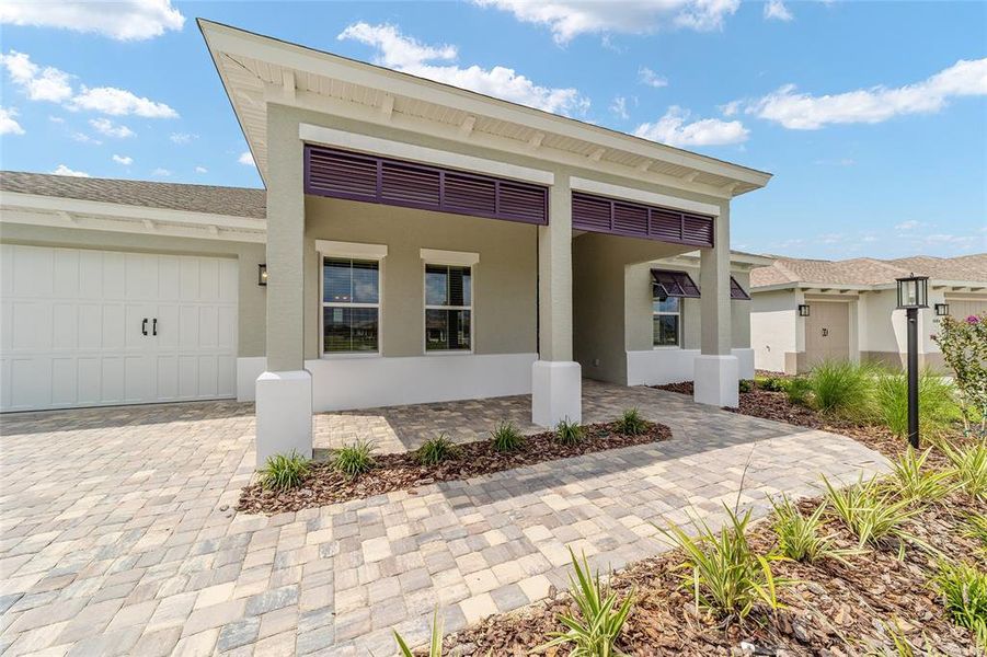 Front exterior of a new home in On Top of the World Communities, Ocala, FL, highlighting curb appeal (Image 22).