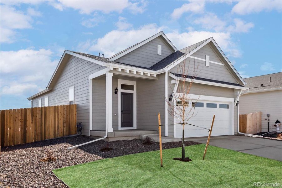 Front exterior of a new home in Second Creek Farm, Commerce City, CO, highlighting curb appeal (Image 1). Front exterior of a new home in Second Creek Farm, Commerce City, CO, highlighting curb appeal (Image 1).