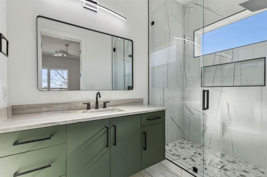 Bathroom with vanity and an enclosed shower