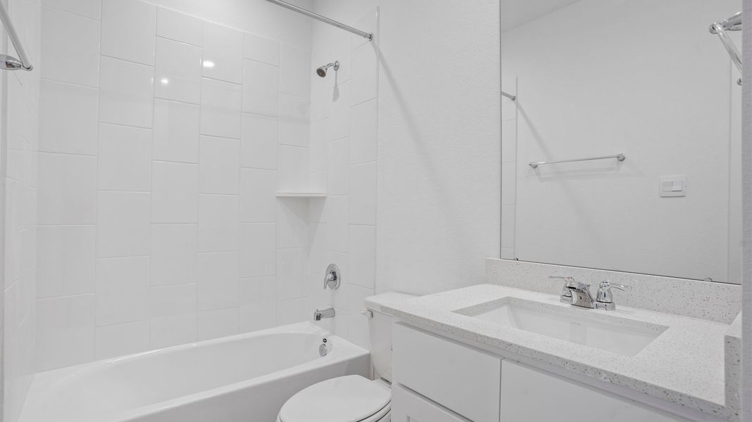Representative furnished interior of a home built from the Mitchell by D.R. Horton in Caldwell Crossing, Iowa Colony (Image 9).