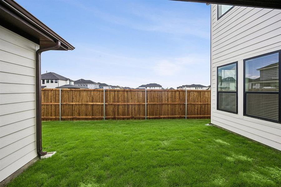 Exterior details and patio area of a home in Fields - East Village, Frisco (Image 19).