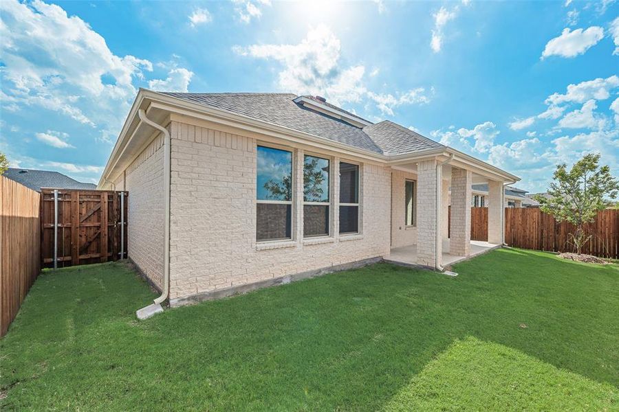 Front exterior of a new home in Villages of Hurricane Creek, Anna, TX, highlighting curb appeal (Image 19). Front exterior of a new home in Villages of Hurricane Creek, Anna, TX, highlighting curb appeal (Image 19).