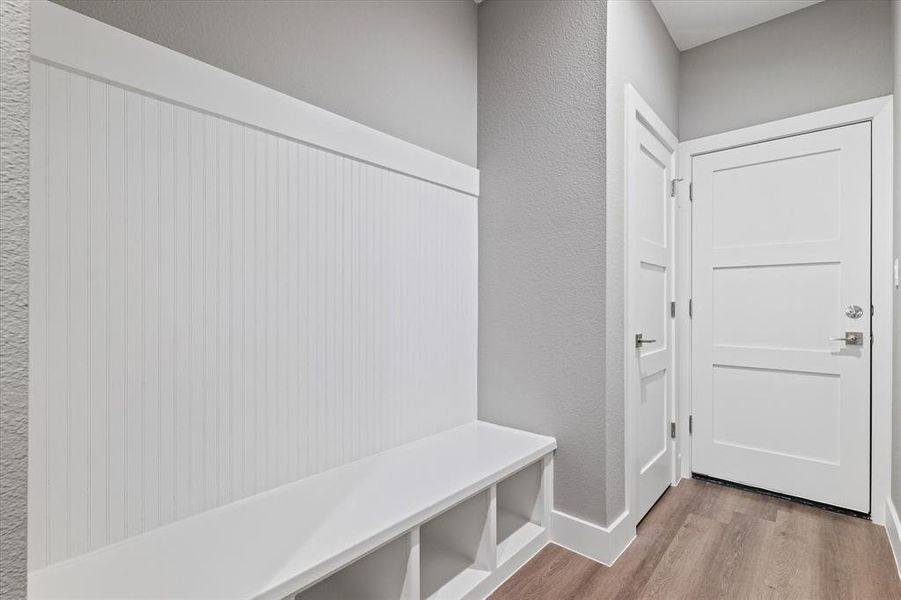 Mudroom featuring light wood-type flooring