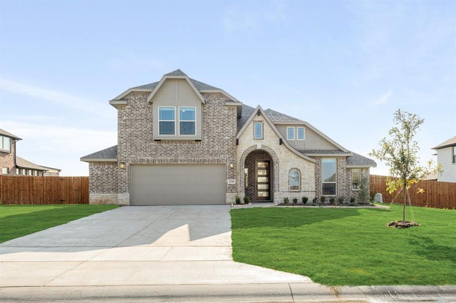 Front exterior of a new home in Coyote Crossing, Godley, TX, highlighting curb appeal (Image 24). Front exterior of a new home in Coyote Crossing, Godley, TX, highlighting curb appeal (Image 24).