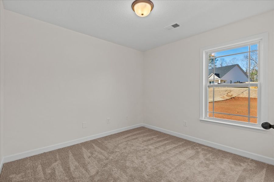 Representative unfurnished interior of a home built from the Cheshire by Enchanted Homes in Hampshire Heights, Moore (Image 24).
