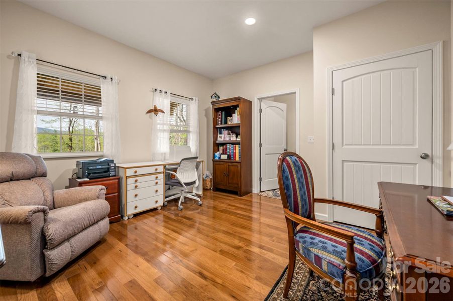 Downstairs office with a closet and entry to the upstairs Downstairs office with a closet and entry to the upstairs