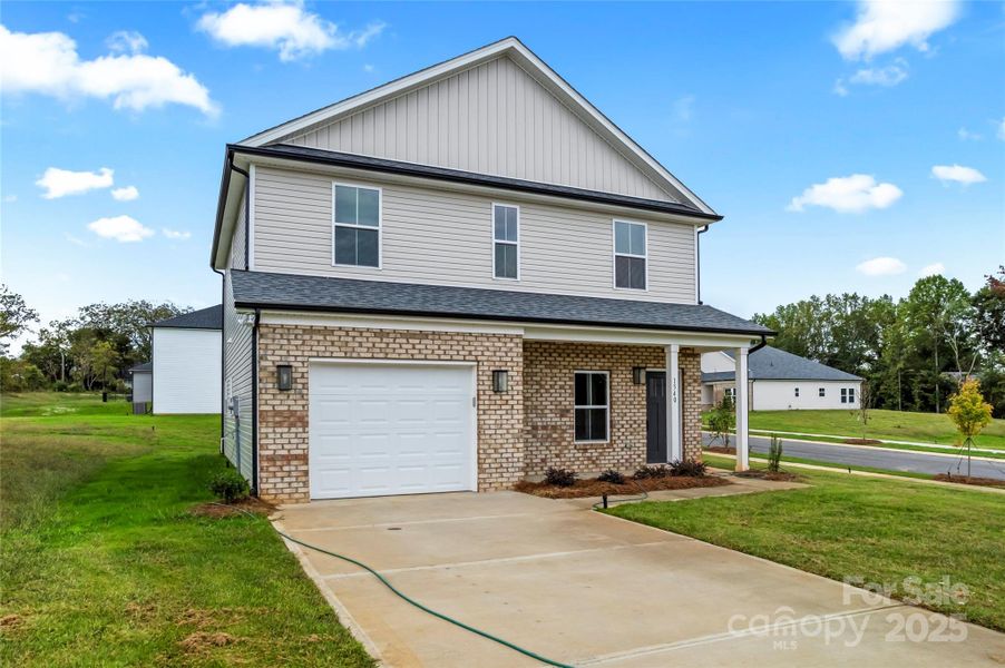Front exterior of a new home in , Kannapolis, NC, highlighting curb appeal (Image 1).