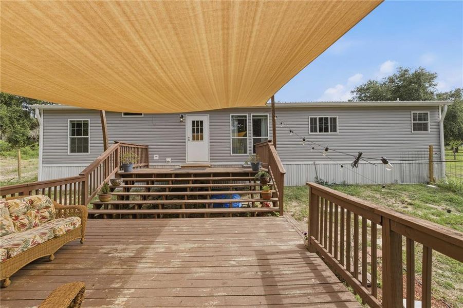 Exterior details and patio area of a home in , Weirsdale (Image 25).