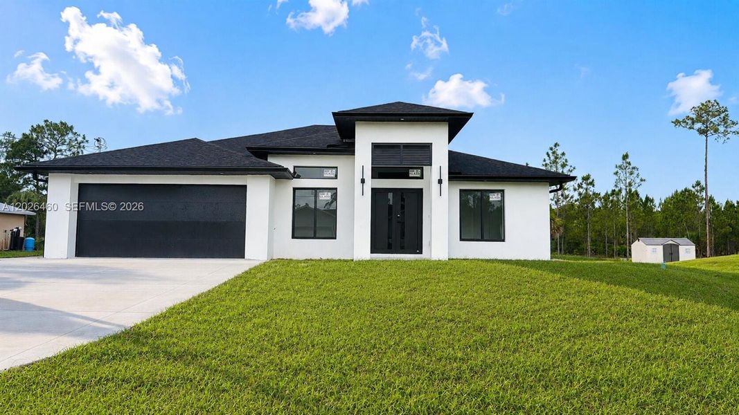 Front exterior of a new home in , Lehigh Acres, FL, highlighting curb appeal (Image 25).