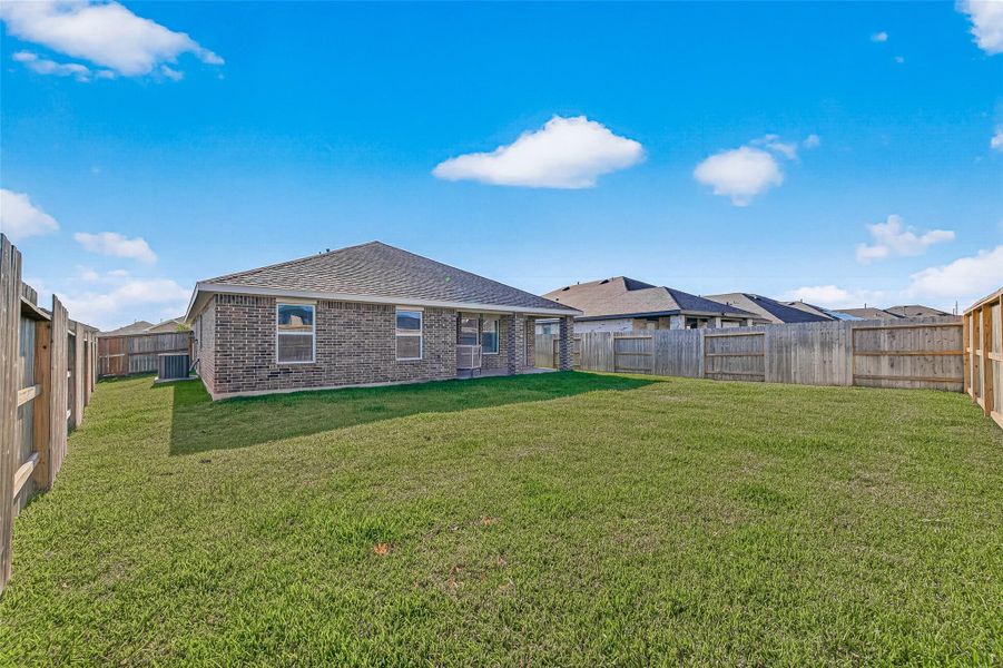 Exterior details and patio area of a home in Sunterra, Katy (Image 23).