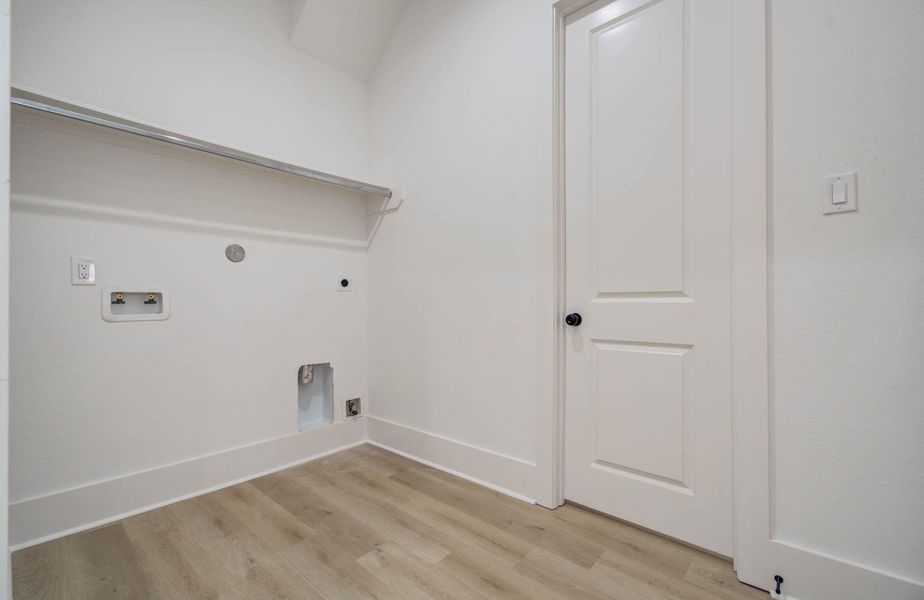 walk-in closet that leads to the large laundry room walk-in closet that leads to the large laundry room