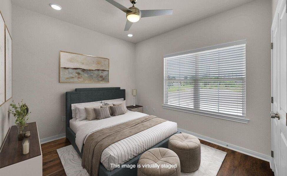 Bedroom with wood finished floors, a ceiling fan, and recessed lighting