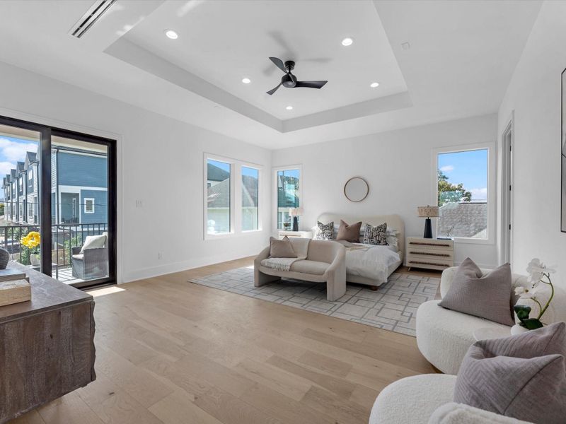 The Primary Bedroom is a haven to enjoy - high ceilings and enchanting views of the back yard.