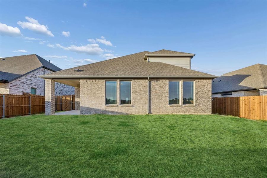 Covered Patio in the Wimbledon home plan by Trophy Signature Homes – REPRESENTATIVE PHOTO Covered Patio in the Wimbledon home plan by Trophy Signature Homes – REPRESENTATIVE PHOTO