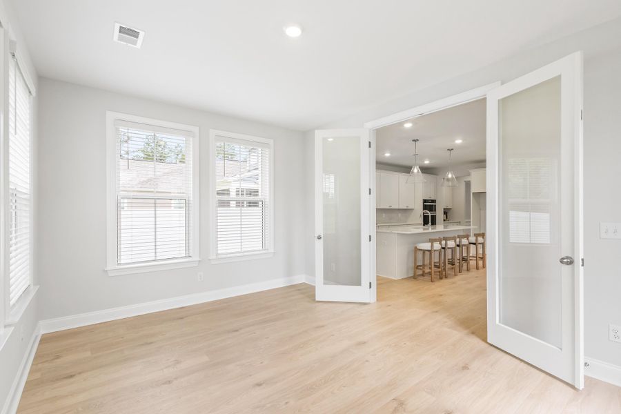 Spacious, unfurnished interior of a new home in Tidewater at Lakes of Cane Bay, Summerville (Image 50).
