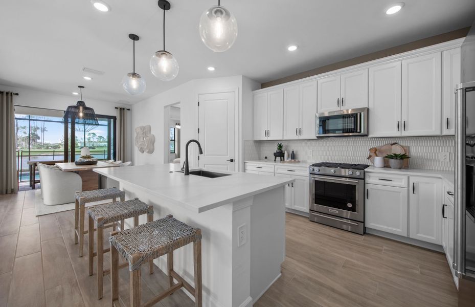 Kitchen with decorative back-splash and large center island Kitchen with decorative back-splash and large center island