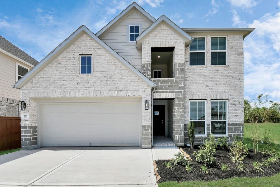 This home boasts lush green grass and meticulous landscaping. Its premium elevation showcases an exquisite blend of brick and stone features, complemented by modern coach lighting. This home boasts lush green grass and meticulous landscaping. Its premium elevation showcases an exquisite blend of brick and stone features, complemented by modern coach lighting.