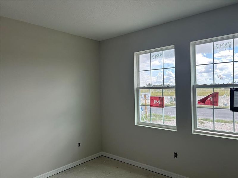 In-progress construction of a new home in Oakfield Trails Signature, Parrish, FL (Image 5).