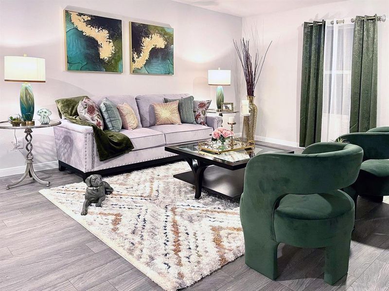 Living room featuring baseboards and wood finished floors