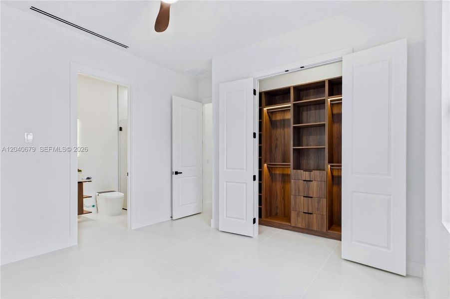 Split floorplan offers privacy for family & guests, including a spacious 2nd primary suite w/ ensuite bathroom, additional guest bedroom & full hall bath