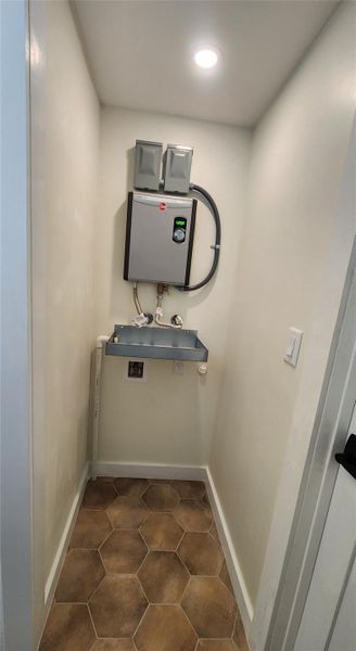 Water heater and washer/dryer combo space (30" wide) Water heater and washer/dryer combo space (30" wide)