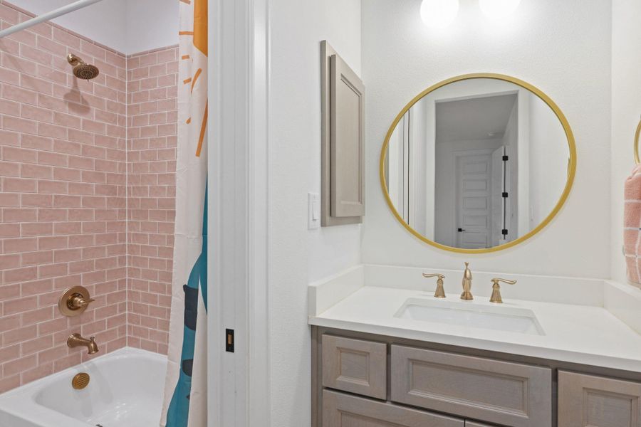 Full bath featuring vanity and shower / tub combo with curtain
