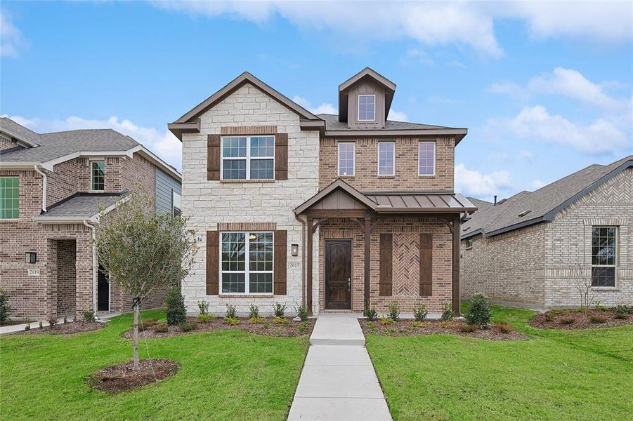 View of front of property with a front yard