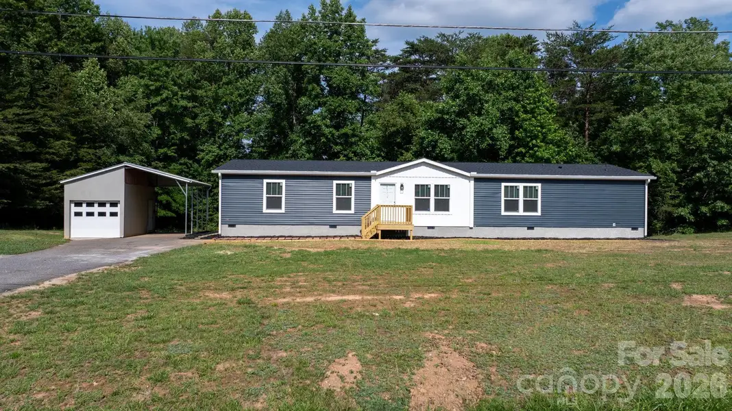 View of front and garage/carport