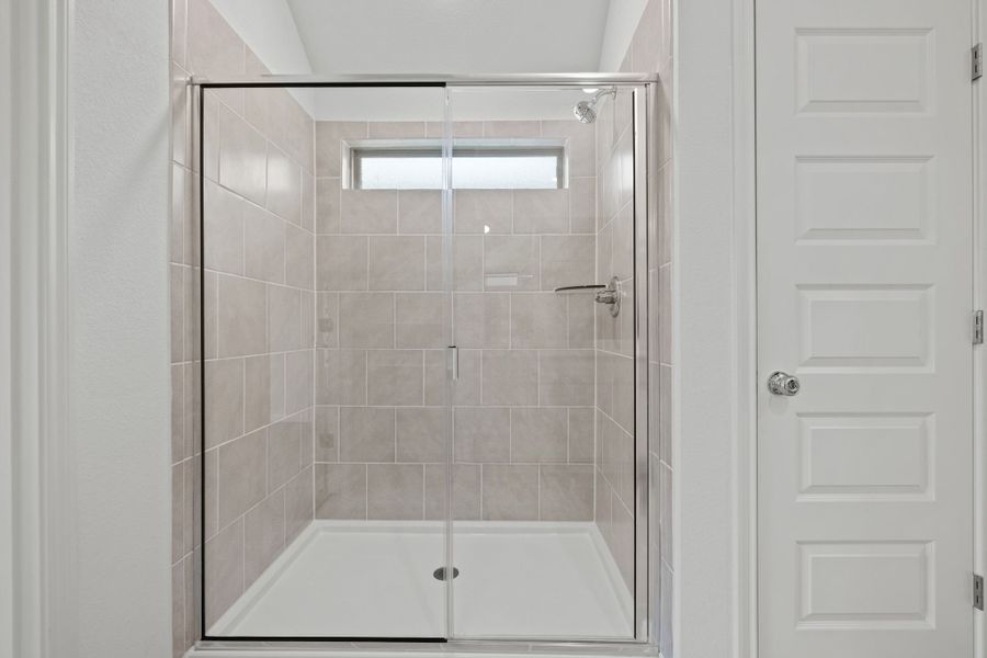 Primary Bathroom in the Quartz home plan by Trophy Signature Homes – REPRESENTATIVE PHOTO