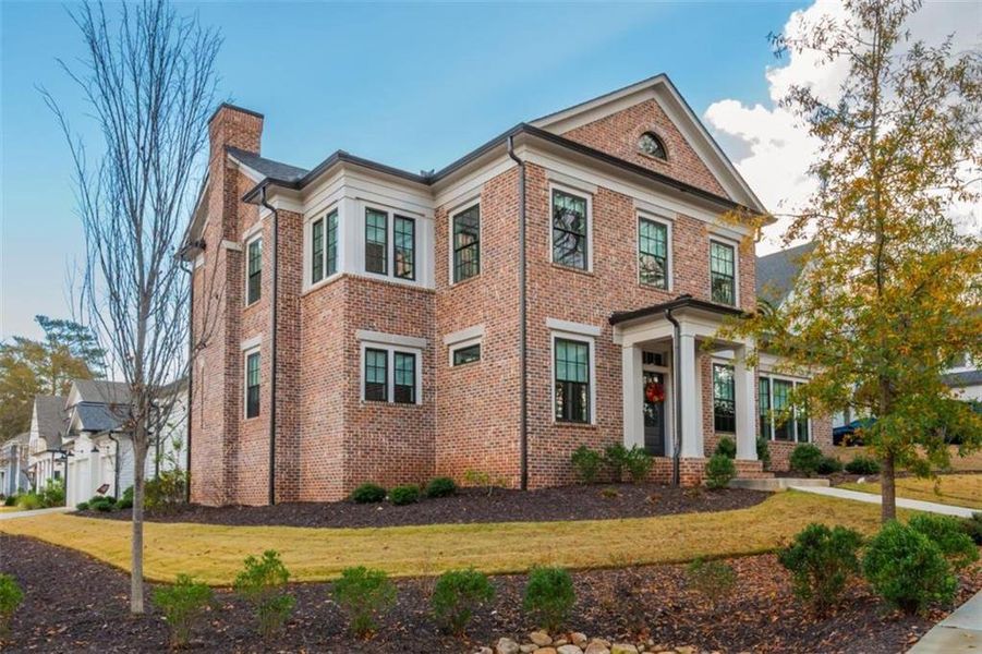 Front exterior of a new home in Barrington Place, Roswell, GA, highlighting curb appeal (Image 2). Front exterior of a new home in Barrington Place, Roswell, GA, highlighting curb appeal (Image 2).