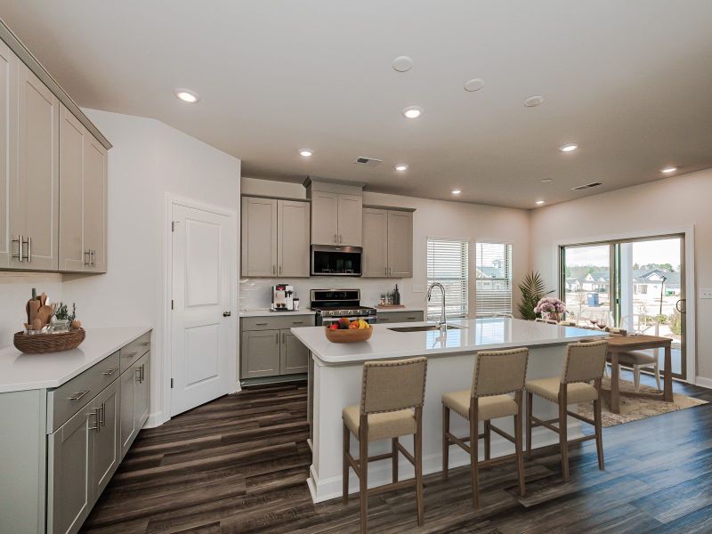 Sit at the kitchen island and enjoy coffee during busy mornings.