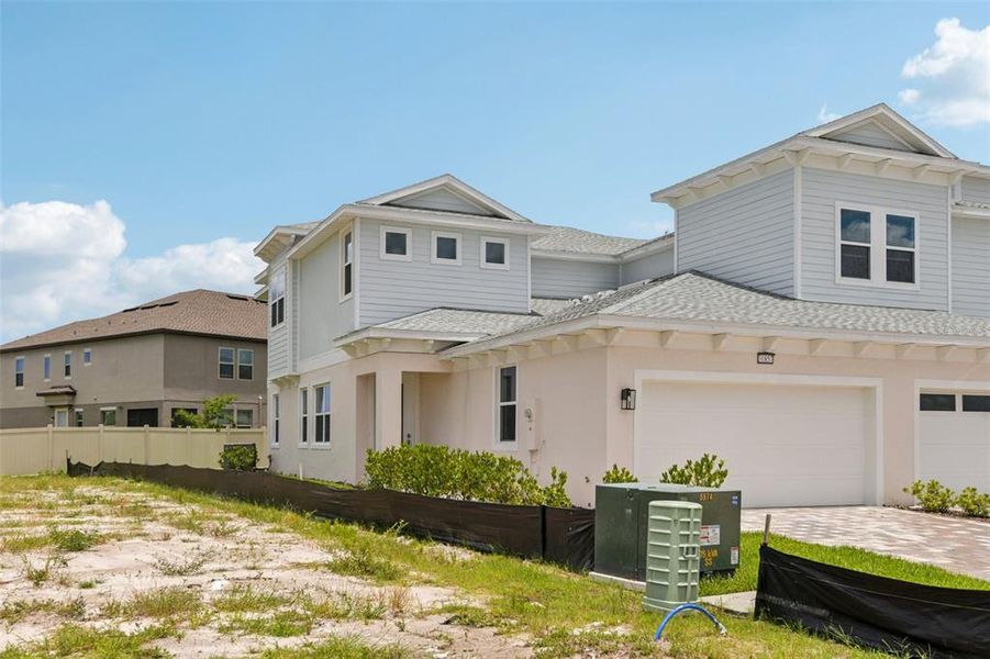 Front exterior of a new home in Lagoon Residences at Epperson, Wesley Chapel, FL, highlighting curb appeal (Image 24).