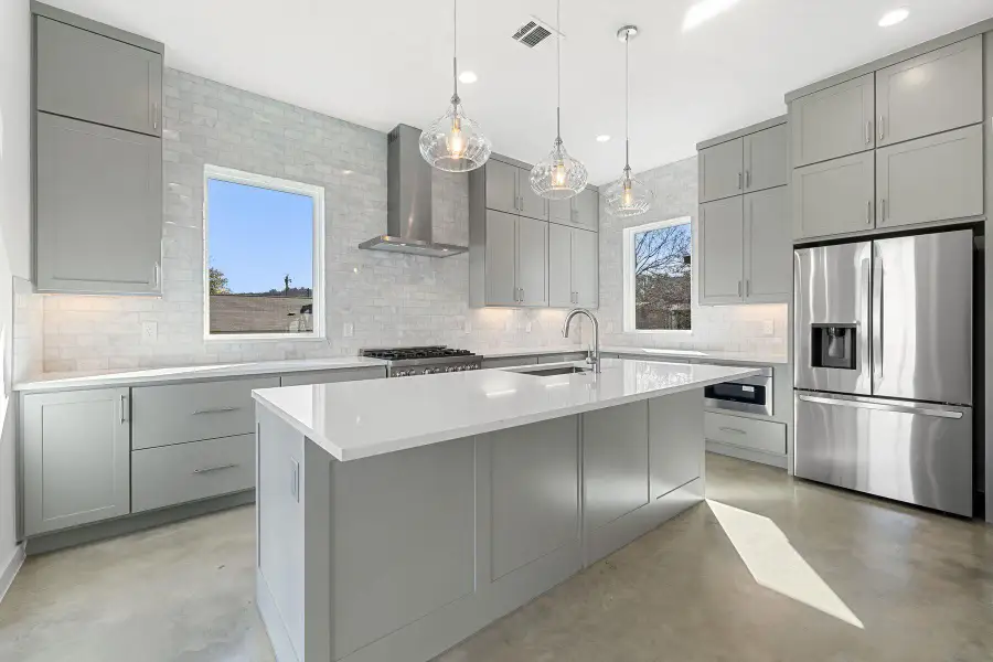 Kitchen with gray cabinets, stainless steel fridge, Deep sink, exhaust hood, Dishwasher,Microwave