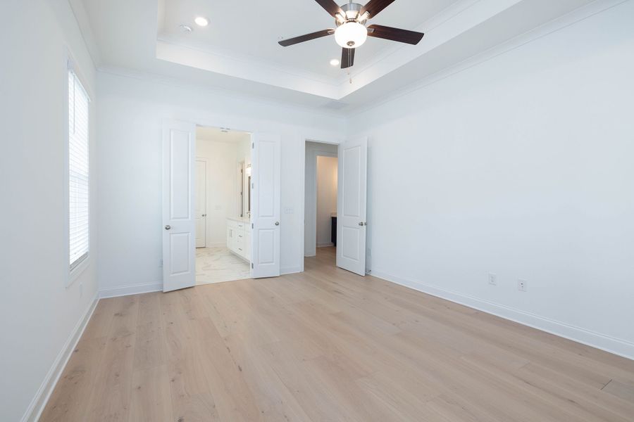 The master suite includes a private bath and walk-in closet