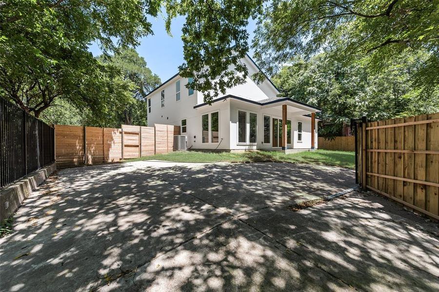Back of property featuring a patio area, a fenced backyard, and stucco siding