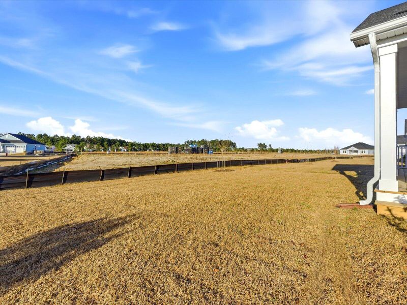 Exterior details and patio area of a home in The Coves at Lakes of Cane Bay, Summerville (Image 4). Exterior details and patio area of a home in The Coves at Lakes of Cane Bay, Summerville (Image 4).