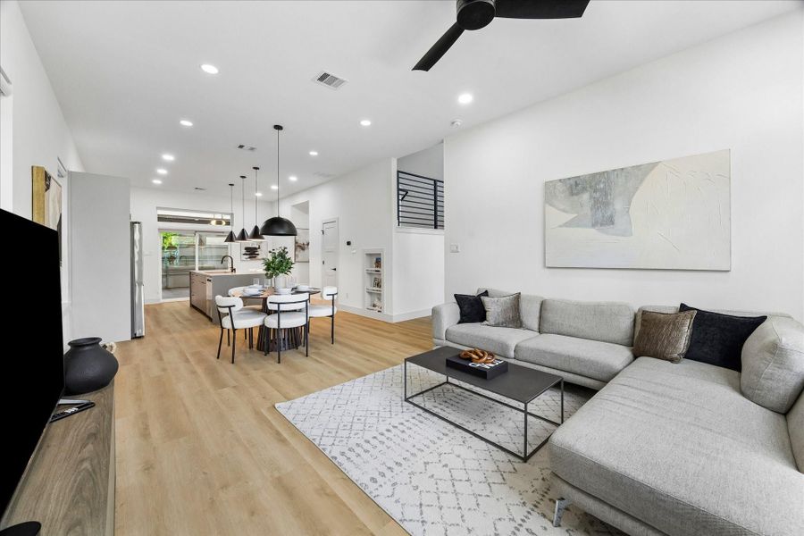 Open concept living allows each space to flow effortlessly together, creating an inviting environment that feels equally suited for everyday living and entertaining.