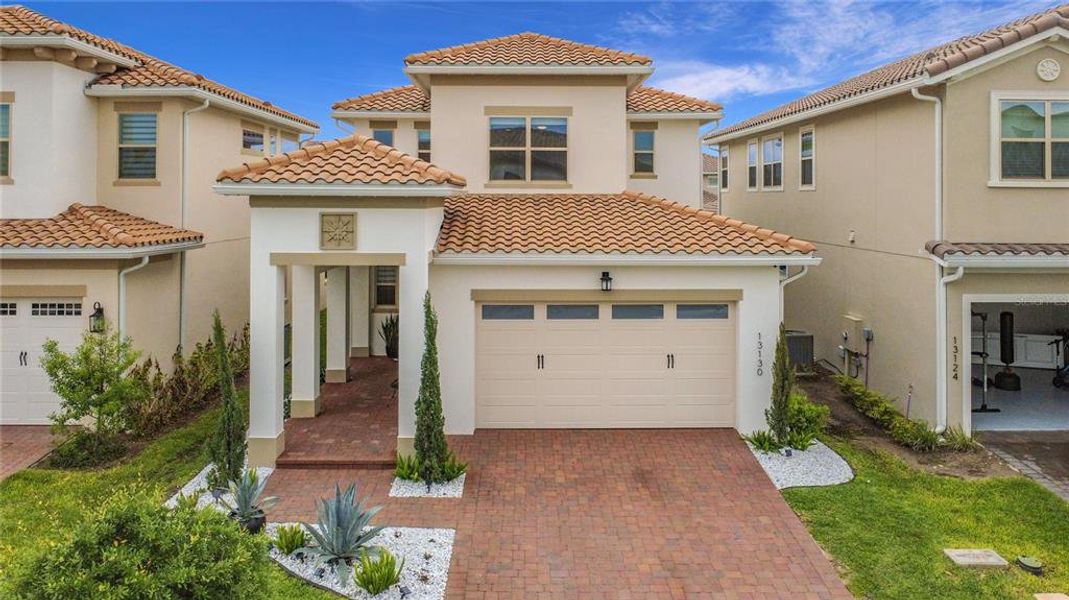 Front exterior of a new home in , Orlando, FL, highlighting curb appeal (Image 27).