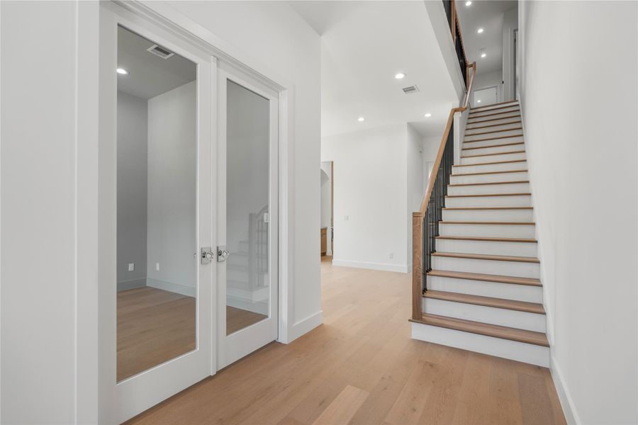 Welcoming foyer with staircase access.