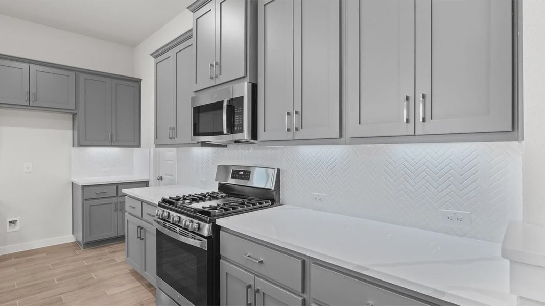 Representative furnished interior of a home built from the Dayton by Chesmar Homes in Lariat, Liberty Hill (Image 5).
