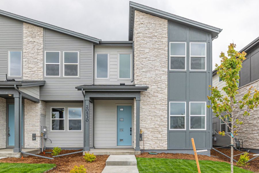Front exterior of a new home in Painted Prairie, Aurora, CO, highlighting curb appeal (Image 2).